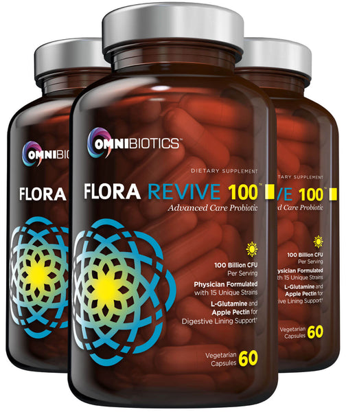 Three bottles of OmniBiotics Flora Revive supplements, each with a clear liquid content visible through the bottle. The packaging indicates it contains 100 billion collagen, 60 billion L-glutamine, and 500 mg vitamin C, with a claim of 'Advanced Care Probiotics'.